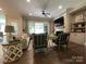 Spacious living room with a cozy fireplace, stylish furniture, and hardwood floors creating an inviting atmosphere at 3201 Johnny Cake Ln, Charlotte, NC 28226