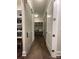 Hallway features sliding barn doors, leading to a mudroom at 3201 Johnny Cake Ln, Charlotte, NC 28226