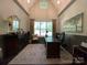 Bright home office with a large window, comfortable seating, and elegant decor for a productive workspace at 3201 Johnny Cake Ln, Charlotte, NC 28226
