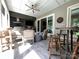 Entertaining patio with an outdoor kitchen, dining area, and comfortable seating at 3201 Johnny Cake Ln, Charlotte, NC 28226