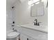 Bright bathroom featuring tub and shower combo, toilet, and vanity with black hardware at 3220 Riley Ave, Charlotte, NC 28269