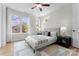 Bedroom featuring a large window, light wood floors and a neutral color palette at 3220 Riley Ave, Charlotte, NC 28269