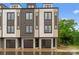 Contemporary townhome featuring a modern design and a well-kept lawn perfect for relaxing at 3220 Riley Ave, Charlotte, NC 28269
