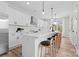 Spacious kitchen with modern appliances and a large island with bar stool seating at 3220 Riley Ave, Charlotte, NC 28269