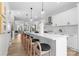 Spacious kitchen with modern appliances and a large island with bar stool seating at 3220 Riley Ave, Charlotte, NC 28269