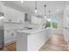 Modern kitchen featuring stainless steel appliances, a large island with seating, and stylish pendant lighting at 3220 Riley Ave, Charlotte, NC 28269