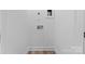 Laundry room with white walls and wood-look floor at 3220 Riley Ave, Charlotte, NC 28269