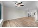 Spacious living area with modern lighting, ceiling fan, and seamless flow into the open kitchen at 3220 Riley Ave, Charlotte, NC 28269