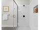 Bathroom shower featuring a clear glass enclosure and white subway tile at 3220 Riley Ave, Charlotte, NC 28269