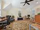 Spacious bonus room with hardwood floors, shuttered windows, ceiling fan and comfortable seating with desk space at 332 Delburg St, Davidson, NC 28036