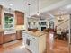 Open-concept kitchen with island flows into living and dining areas, great for entertaining at 332 Delburg St, Davidson, NC 28036