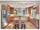 Stylish kitchen featuring granite countertops, stainless steel appliances, and a central island with seating at 332 Delburg St, Davidson, NC 28036