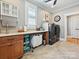Well-lit laundry room featuring modern washer and dryer, countertop workspace, and convenient storage solutions at 332 Delburg St, Davidson, NC 28036