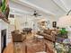Cozy living room with hardwood floors, comfortable seating, and an open layout to dining and kitchen at 332 Delburg St, Davidson, NC 28036