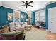 Beautiful living room featuring comfortable seating, natural light, stylish furnishings and desk space at 332 Delburg St, Davidson, NC 28036