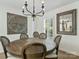 Elegant dining room with modern chandelier and large round table for gatherings at 3620 Champaign St, Charlotte, NC 28210