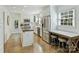 Bright kitchen with stainless steel appliances, white cabinetry, and hardwood floors at 3620 Champaign St, Charlotte, NC 28210