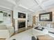 Bright living room with a fireplace, coffered ceiling, and hardwood floors at 3620 Champaign St, Charlotte, NC 28210