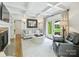 Spacious living room with a fireplace, coffered ceiling, and ample seating at 3620 Champaign St, Charlotte, NC 28210