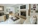Open concept living room with a fireplace, and a view of the kitchen at 3620 Champaign St, Charlotte, NC 28210