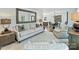 Cozy living room featuring hardwood floors, neutral furniture, and abundant natural light at 3620 Champaign St, Charlotte, NC 28210