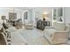Bright living room with neutral color palette, plantation shutters, and hardwood floors at 3620 Champaign St, Charlotte, NC 28210