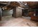 Unfinished basement space with exposed ceilings, cinder block walls, and brick facade, ready for customization at 3700 Nw Gainesway Nw Ct, Concord, NC 28027