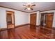 Bright bedroom featuring hardwood floors, natural lighting, and ample closet space at 3700 Nw Gainesway Nw Ct, Concord, NC 28027
