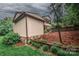 Two-story home with siding and brick detail, landscaped yard, and retaining wall at 3700 Nw Gainesway Nw Ct, Concord, NC 28027