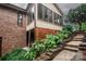 Exterior view of the home showing the sunroom and landscaping at 3700 Nw Gainesway Nw Ct, Concord, NC 28027