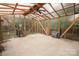 Interior of the greenhouse featuring a ceiling fan, translucent walls and framing at 3700 Nw Gainesway Nw Ct, Concord, NC 28027