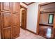 Hallway with tile flooring, wood trim and linen closet at 3700 Nw Gainesway Nw Ct, Concord, NC 28027