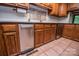 A bright kitchen featuring stainless steel appliances, wooden cabinets, tile flooring, and modern fixtures at 3700 Nw Gainesway Nw Ct, Concord, NC 28027