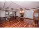 Large living room featuring hardwood floors, fireplace, and tray ceiling at 3700 Nw Gainesway Nw Ct, Concord, NC 28027