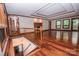Large living room with fireplace, hardwood floors, and staircase to lower level at 3700 Nw Gainesway Nw Ct, Concord, NC 28027