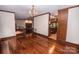 Spacious living room featuring hardwood floors, fireplace, staircase, and open layout at 3700 Nw Gainesway Nw Ct, Concord, NC 28027