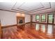 Spacious living room featuring hardwood floors, fireplace, and outdoor access at 3700 Nw Gainesway Nw Ct, Concord, NC 28027