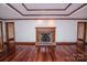 Open living room with hardwood flooring, fireplace, and neutral paint at 3700 Nw Gainesway Nw Ct, Concord, NC 28027