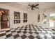 Bright sunroom with checkered floors and large windows offering views of the outdoors at 3700 Nw Gainesway Nw Ct, Concord, NC 28027