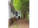Backyard features a screened porch and stairs to the ground, blending indoor/outdoor living at 400 Archibald Rd, Concord, NC 28025