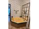 Bathroom features a corner bathtub, corner mirror, and floral wallpaper at 400 Archibald Rd, Concord, NC 28025