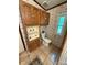 Bathroom featuring built-in cabinets, toilet and window at 400 Archibald Rd, Concord, NC 28025