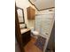 Bathroom featuring a shower, toilet, sink, and wood-look floors at 400 Archibald Rd, Concord, NC 28025
