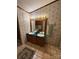Bathroom featuring a dual sink vanity, floral wallpaper, and tile floors at 400 Archibald Rd, Concord, NC 28025
