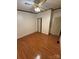 A spacious bedroom with wood floors, ceiling fan, and trim at 400 Archibald Rd, Concord, NC 28025