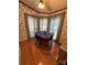 Charming dining area featuring wood floors and bay windows at 400 Archibald Rd, Concord, NC 28025