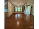 Dining room featuring wood floors and a window with a view of the yard at 400 Archibald Rd, Concord, NC 28025