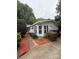 Well-maintained single-story home with wood steps and landscaped front yard creates a welcoming curb appeal at 400 Archibald Rd, Concord, NC 28025