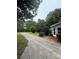 Long driveway leads to the property with manicured landscaping, showcasing the home's curb appeal at 400 Archibald Rd, Concord, NC 28025