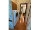 Hallway with washer and dryer and doorway to bathroom at 400 Archibald Rd, Concord, NC 28025
